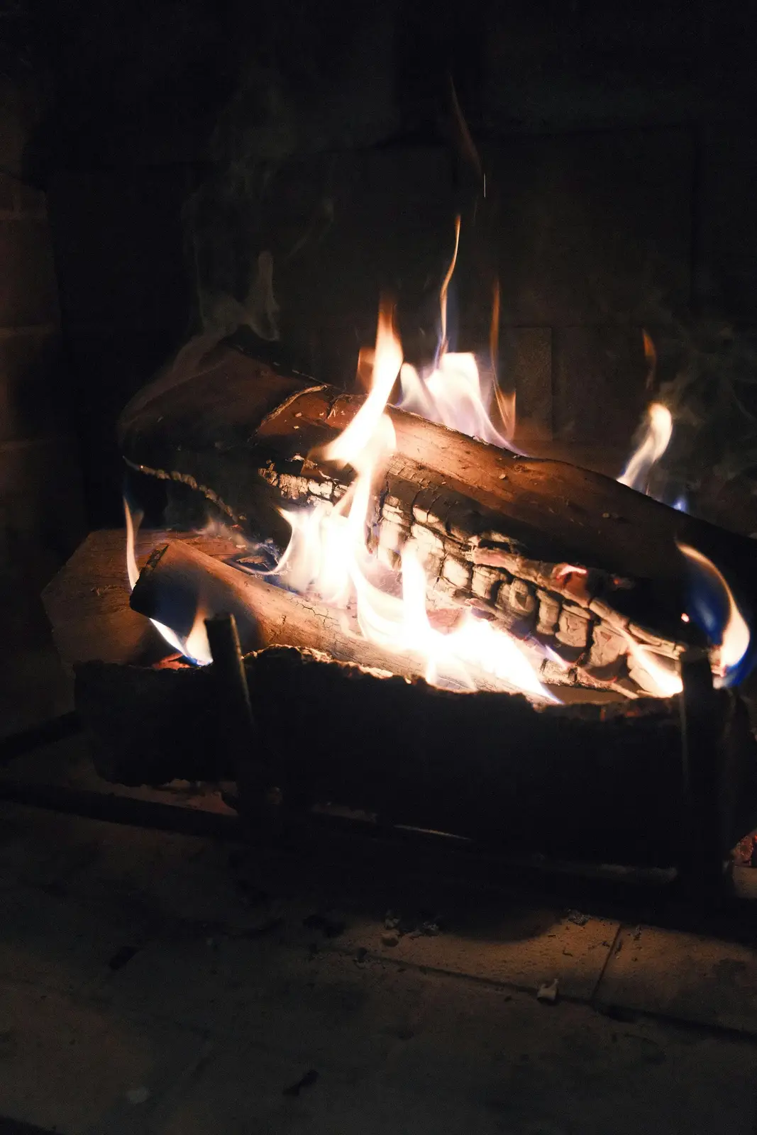 Alder and oak logs burning in an open hearth