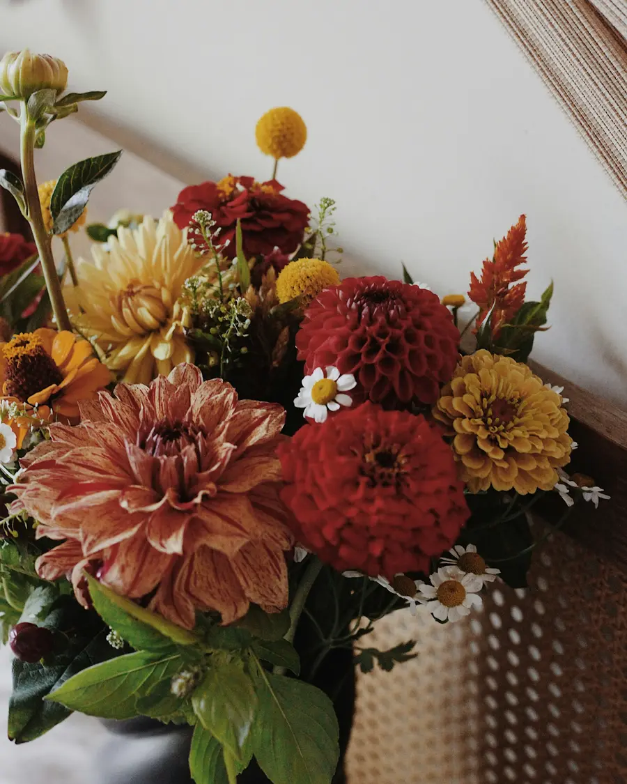 A generous bunch of red, coral and yellow dahlias