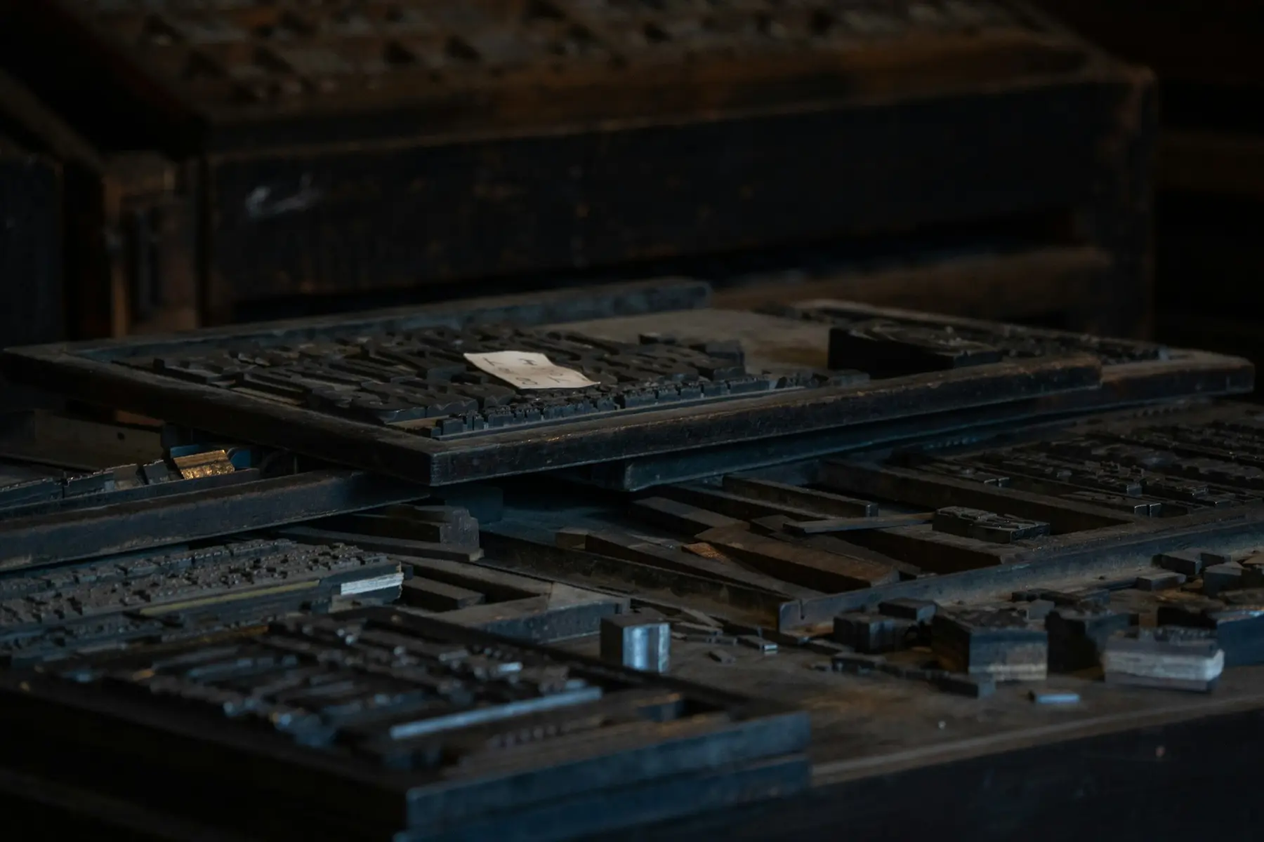 Printing-press type cases filled with rows of metal letters