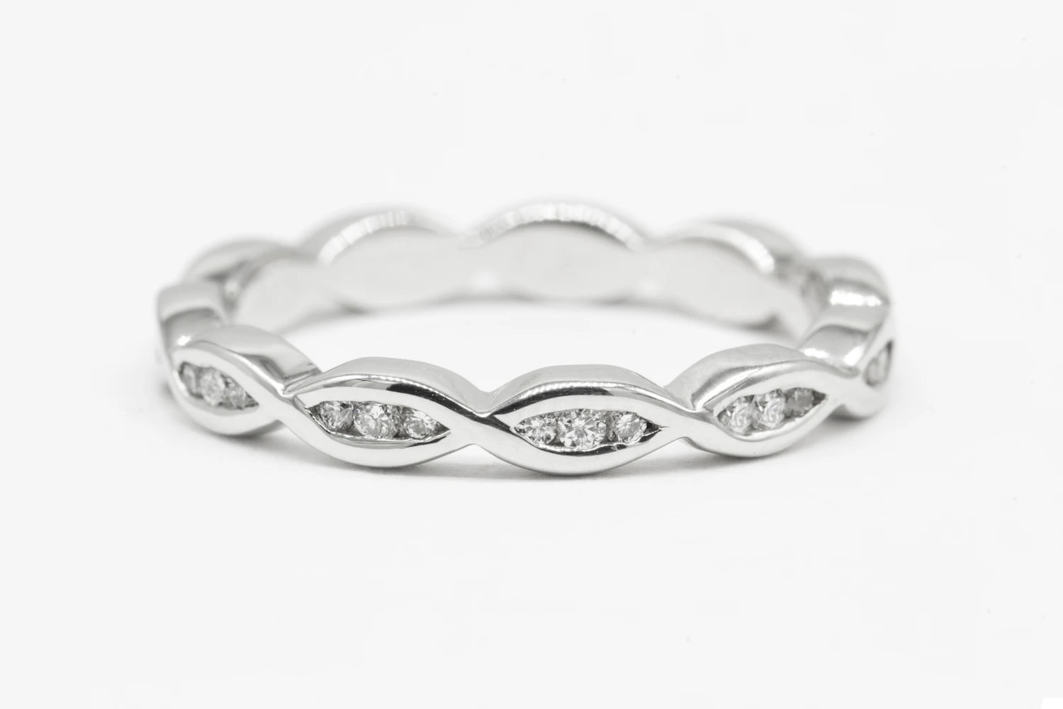 White-gold eternity ring of two entwined diamond-set strands