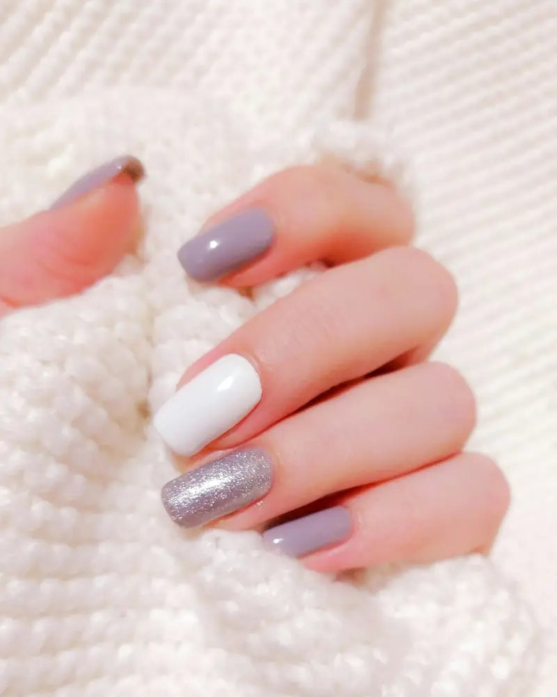Squoval nails in mauve and lilac with a silver glitter accent nail